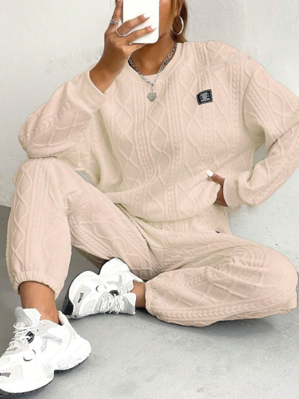 Close-up of soft premium polyester fabric on Sylvenza tan seated outfit