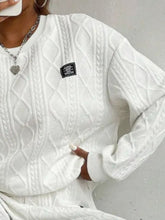 Close-up of premium ogee wheat texture and soft polyester fabric on Sylvenza white seated outfit