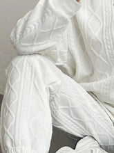 Zoomed in close-up of premium soft polyester fabric on Sylvenza white seated outfit