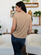 Back view of a tan V-neck short sleeve T-shirt, featuring delicate sheer polkadot mesh detail.