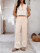 Woman in Tan Xyvello Set posing by cottage door highlighting intricate contrast design on premium fabric