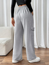 Back view showcasing fit and pocket detail of TaviraFlex™ joggers
