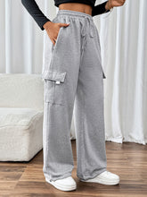 Action shot of model wearing TaviraFlex™ joggers in motion