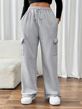 Model styling TaviraFlex™ joggers with sneakers and casual top
