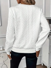 a model showcasing the back of a white Sunset Coastal Bliss Texture Half Zip Long Sleeve Sweatshirt paired with dark blue jeans and jewelry