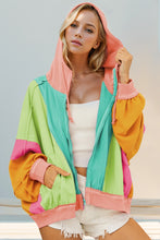 Front view of model wearing a tiffany blue Full Size Color Block Zip Up Hoodie, highlighting the fresh color contrasts, functional zipper, and comfortable hooded style.