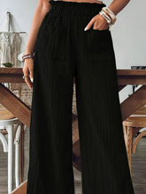 Black Velonni™ Wide Leg Trousers styled for a chic day-to-night look
