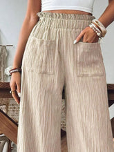 Close-up of waistband, frill accents, and pockets on FrillEase khaki trousers