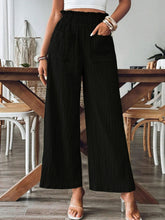 Front view of black Velonni™ FrillEase Wide Leg Trousers on model