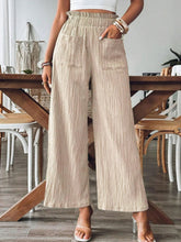 Front view of khaki Velonni™ FrillEase Wide Leg Trousers on model