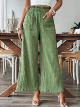 Front view of matcha green Velonni™ FrillEase Wide Leg Trousers on model