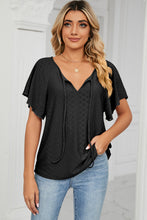 Front view of Veluretta Mistflair Blouse in black with tie-neck and flutter sleeves.