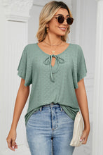 Gum leaf Veluretta Mistflair Blouse paired with denim pants, sun glasses, jewelry, handbag, and heels for date night dinner reservation.