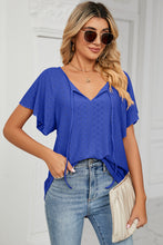 Veluretta Mistflair Blouse styled with jeans and sneakers in ultra marine at evening brunch look.