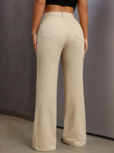 Back view showcasing the pockets and bootcut fit of VelvetaCurve™ jeans.
