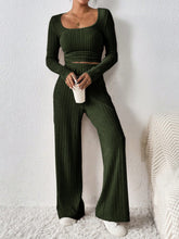 Verdelle Scoop Wide Leg Lounge Duo in army green front view holding a coffee styled with accessories
