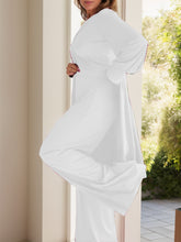 Side view of Kurevelle Slit Round Neck Top and Pants Twosome in White showing wide leg and slit top