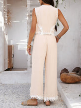 Back view of model wearing Tan Xyvello vest and pants set