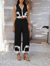 Close-up front view of Black Xyvello contrast trim on vest and pants styled with heels and accessories