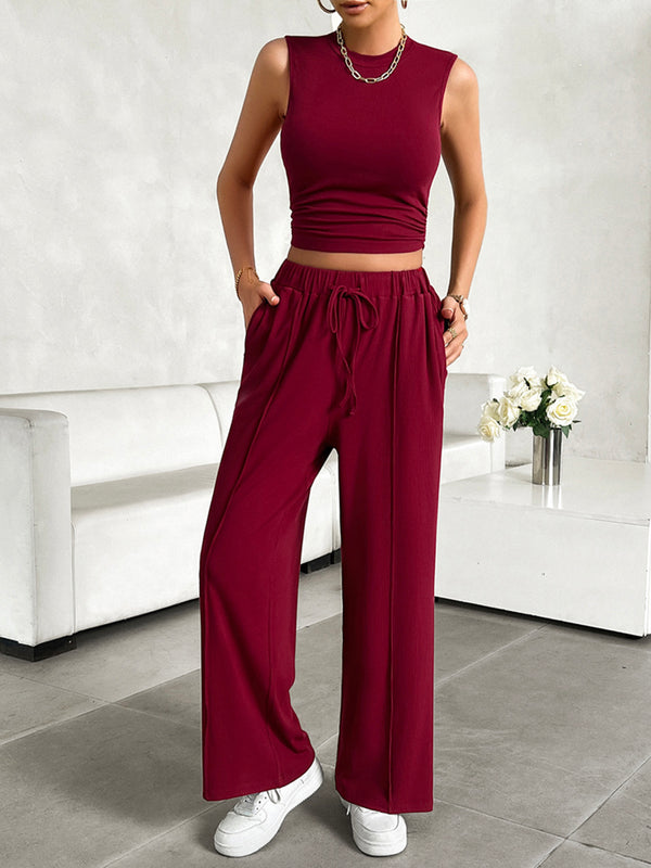 Zenvara Loungewear Set in burgundy styled with white sneakers and accessories highlighting pockets detail