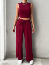 Model wall pose in Zenvara burgundy set
