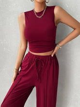 Close up front view of burgundy Zenvara set highlighting mock neck top, premium polyester/elastane blend fabric, and adjustable elastic waist detail