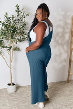 Back view of Cyrella Muse Wide-Leg Overalls in French Blue with adjustable wide straps.