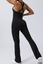 Back view of black AerisCross Vivanta Jumpsuit highlighting strap detail and smooth back fit.