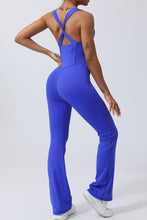 Back view of Blue AerisCross Vivanta Jumpsuit highlighting strap detail and smooth back fit.