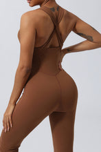Close up rear view of brown AerisCross Vivanta Jumpsuit highlighting fabric texture and crisscross strap junction.