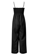 A back photo of the black Smocked Amphitrite's Flow Wide Leg Jumpsuit with a white background