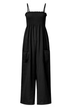 A front photo of a black Smocked Amphitrite's Flow Wide Leg Jumpsuit with a white background.