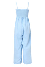 A back photo of the misty blue Smocked Amphitrite's Flow Wide Leg Jumpsuit with a white background