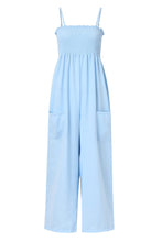 A front photo of a misty blue Smocked Amphitrite's Flow Wide Leg Jumpsuit with a white background.