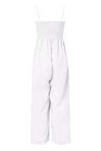A back photo of the white Smocked Amphitrite's Flow Wide Leg Jumpsuit with a white background