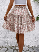 Back view of Apricot Florévyn Midi Skirt showcasing frill tiers and ruffled hem