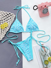 Aqua leopard print halter neck tie side bikini set front flat lay view 