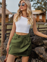 army green adjustable waist denim skirt styled white top sunglasses