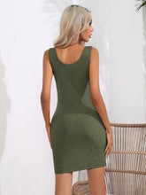 Model back view showcasing the army green Curvalicious Allure Bodycon Mini Dress with a sleek back seam and flattering fit.