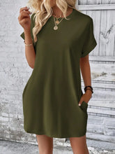 Woman in Army Green Rahluna Mini Tee Dress highlighting soft stretch fabric and flattering drape.