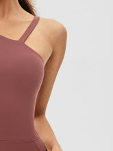 close-up of spaghetti strap side of asymaflow jumpsuit brown