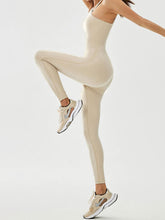 tree yoga pose in asymaflow jumpsuit cream