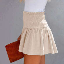 Apricot pleated high elastic waist textured shorts side angle.