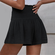 Black pleated high elastic waist textured shorts back view.