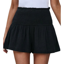 Black pleated high elastic waist textured shorts front view.