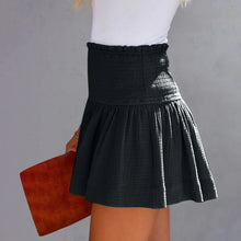 Black pleated high elastic waist textured shorts side angle.