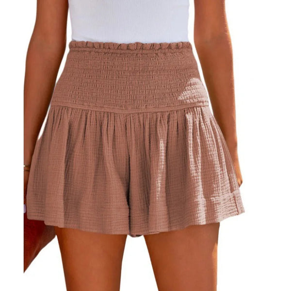 Cameo pink pleated high elastic waist textured shorts front view.