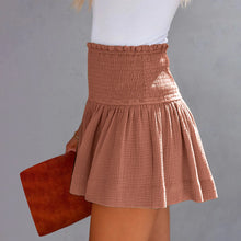 Cameo pink pleated high elastic waist textured shorts side angle.