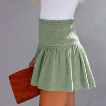 Light green pleated high elastic waist textured shorts side angle.