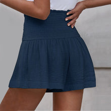 Navy blue pleated high elastic waist textured shorts back view.